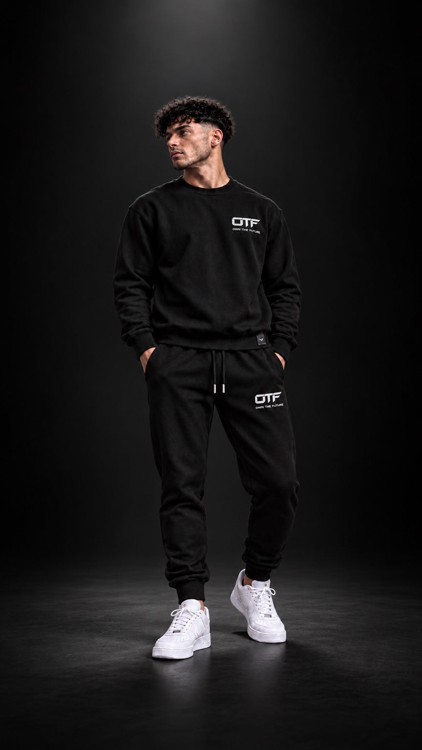 OTF Drop 001 model wearing black tracksuit